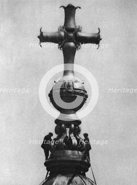 Steeplejacks on the summit of St Paul's Cathedral, London, 1926-1927. Artist: Unknown