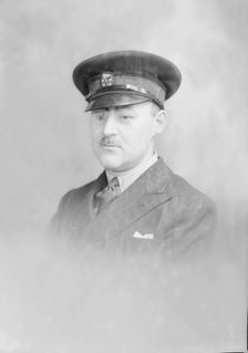 Portrait of a man in uniform, c1935. Creator: Kirk & Sons of Cowes.