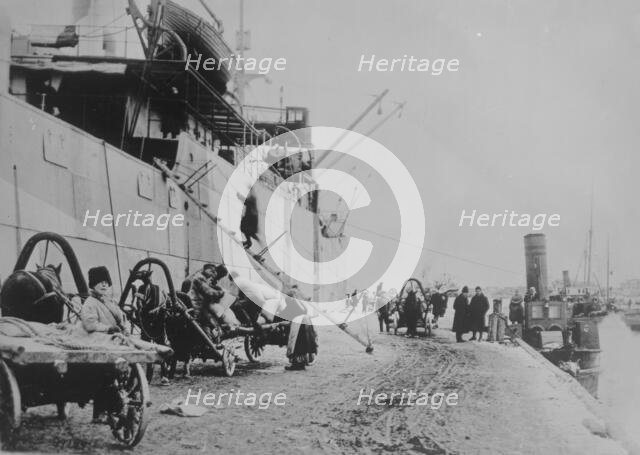 Unloading SEATTLE, Archangel, between c1915 and c1920. Creator: Bain News Service.