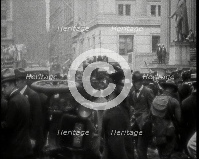 Police Looking Over Overturned Vehicles in New York City After a Bomb Was Thrown at the..., 1920. Creator: British Pathe Ltd.