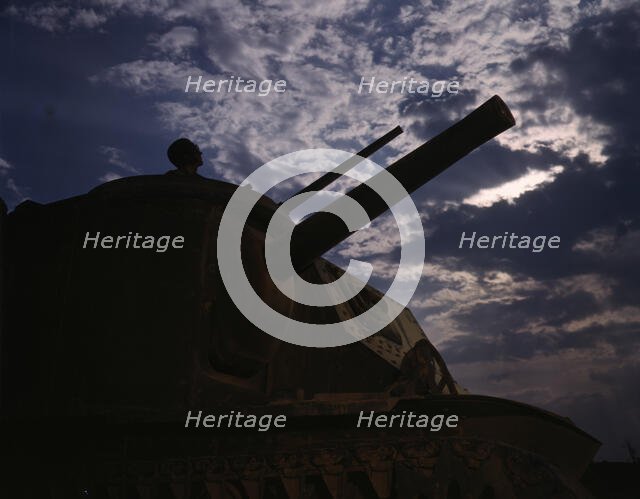 The crew of an M-3 tank learn all the ways of causing trouble for the Axis...Fort Knox, Ky, 1942. Creator: Alfred T Palmer.