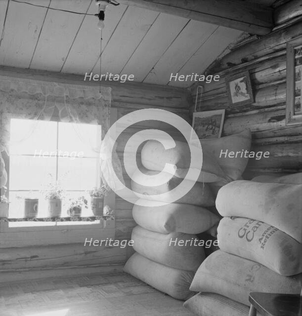 Interior of farmer's two-room log home, FSA borrower, Boundary County, Idaho, 1939. Creator: Dorothea Lange.