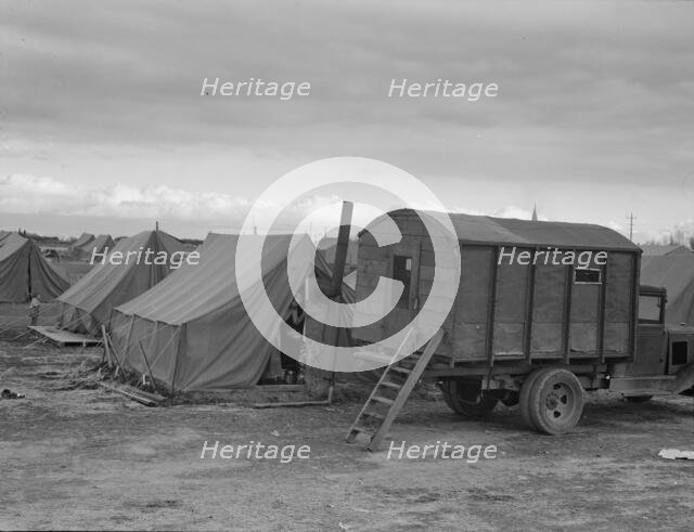 In mobile camp at end of season, cold day, FSA camp, Merrill, Klamath County, Oregon, 1939. Creator: Dorothea Lange.