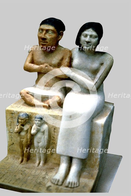 The dwarf Seneb, his wife and two daughters. It comes from Giza.