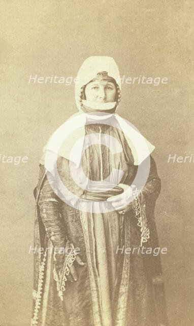 Three-quarter length portrait of woman, facing front, between 1870 and 1886. Creator: Unknown.