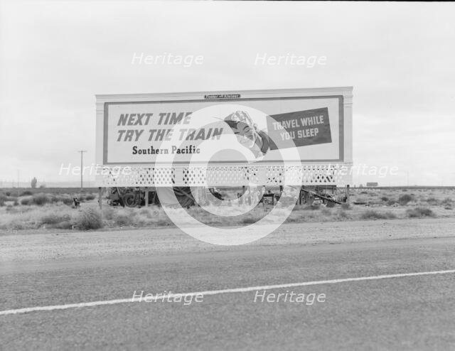 Billboard along U.S. 99...three destitute families...Kern County, CA, 1938. Creator: Dorothea Lange.