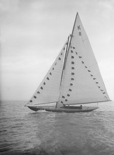 The 7 Metre sailing yacht 'Pinaster' (K8) with prize flags, 1912. Creator: Kirk & Sons of Cowes.