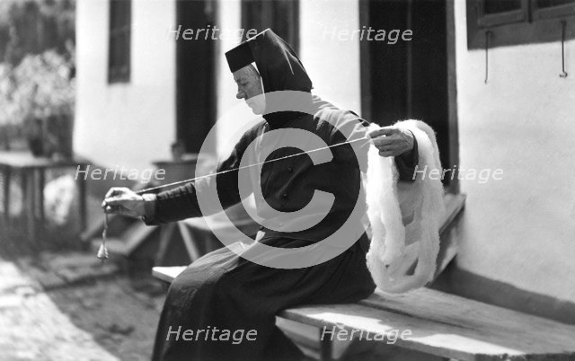 Woman spinning, Bistrita Valley, Moldavia, north-east Romania, c1920-c1945. Artist: Adolph Chevalier