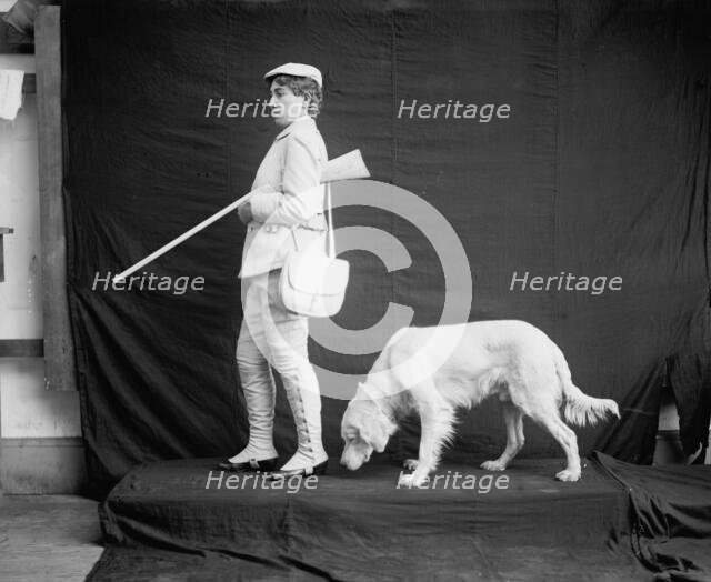 Billy and his mistress in hunting poses, between 1895 and 1910. Creator: Unknown.