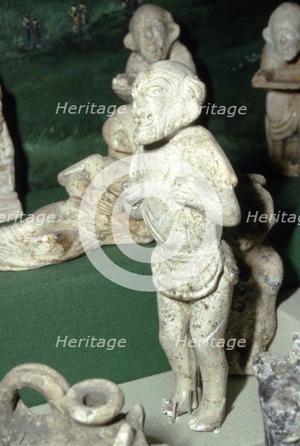 Pipeclay Figure from a Roman Grave, at Colchester, Essex, c60 AD Artist: Unknown.