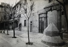 Hospital de la Santa Cruz, Barcelona: a long view of the courtyard; to the right can be seen the... Creator: Unknown.