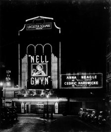 Night view of the Leicester Square theatre, London, c1930. Artist: Larkin