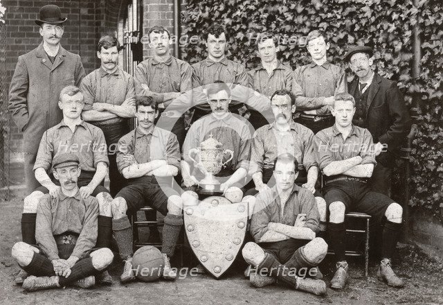 Rowntree Football Club 1st team pose with trophy and cup, York, Yorkshire, 1902. Artist: Unknown