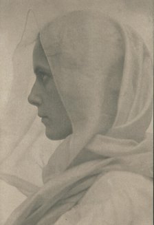 Profile portrait of woman draped with a veil, c1900. Creator: Amelia Van Buren.