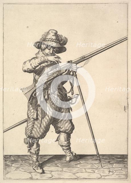 A soldier blowing on a match, from the Musketeers series, plate 40, in Wapenhandelinghe van Ro.... Creator: Unknown.