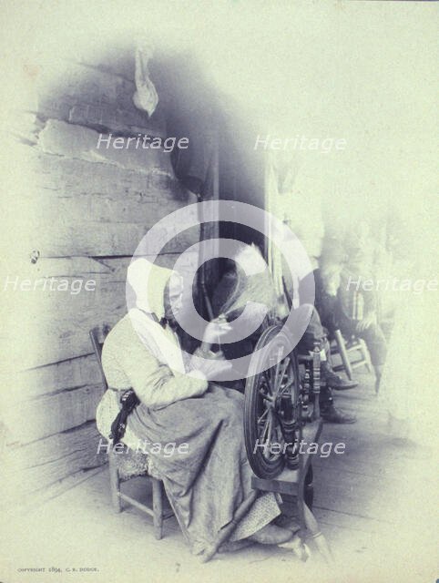 Elderly woman sitting on porch spinning, c1894. Creator: Charles Richards Dodge.