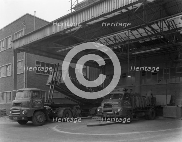 Unloading and loading lorries, Spillers Animal Foods, Gainsborough, Lincolnshire, 1961.  Artist: Michael Walters