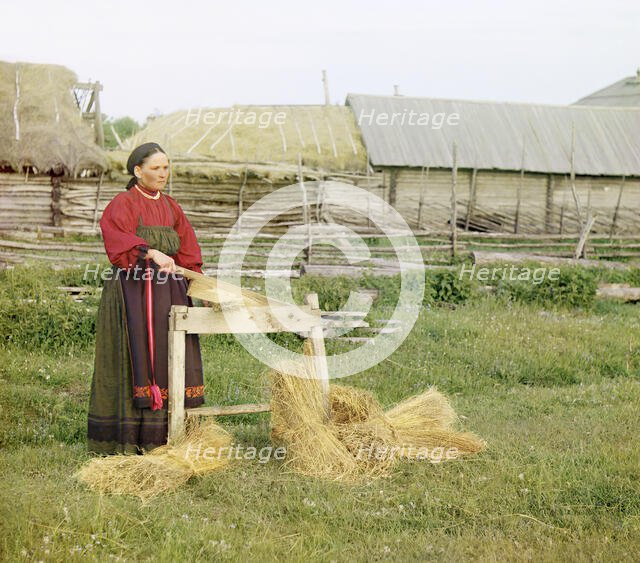 Peasant woman breaking flax;Perm Province, 1910. Creator: Sergey Mikhaylovich Prokudin-Gorsky.