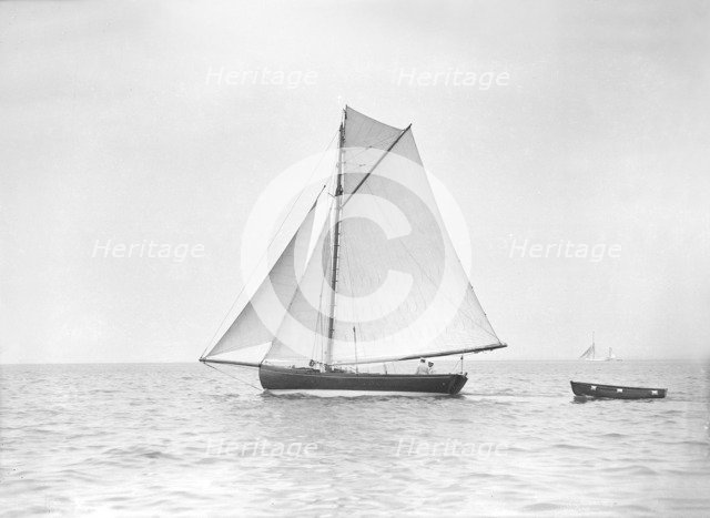 The cutter 'Jammie' under sail, 1911. Creator: Kirk & Sons of Cowes.