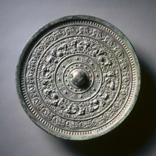 Mirror with Deities and Animals in Concentric Circles, late 6th-early 7th century. Creator: Unknown.