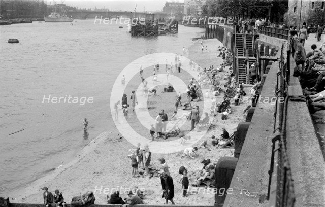Families on Tower Beach, London, c1945-c1955. Artist: SW Rawlings