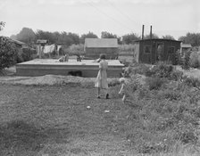 Progressive housing on half acre in Yakima shacktown, Yakima, Washington, 1939. Creator: Dorothea Lange.