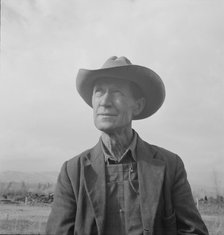 Farmer from Nebraska now developing eighty-acre stump farm, Bonner County, Idaho, 1939. Creator: Dorothea Lange.