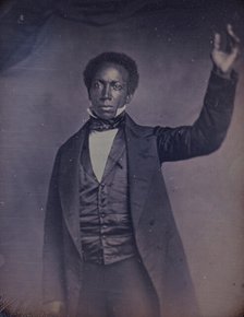 Edward J. Roye, three-quarter length portrait, standing, with hand raised, between 1856 and 1858. Creator: Augustus Washington.