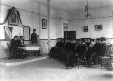 Carlisle Indian School, Carlisle, Pa. Classroom debate by debating society, 1901. Creator: Frances Benjamin Johnston.