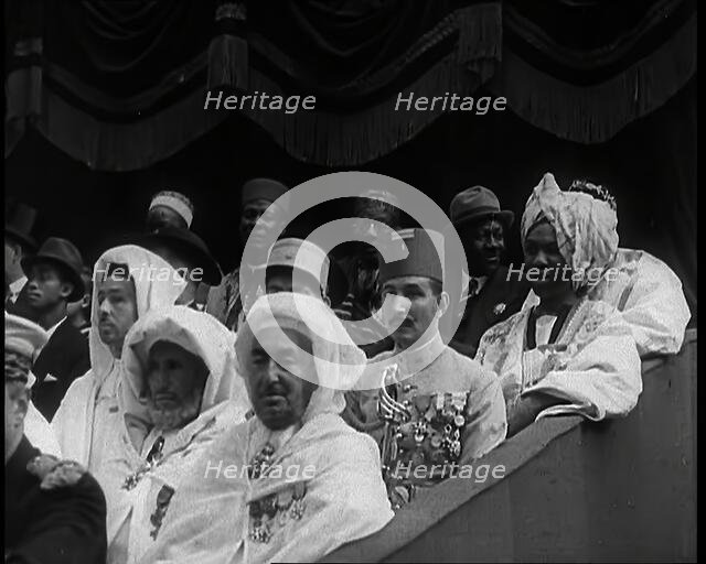 Dignitaries and Representatives from Various African Countries Sitting in Raked Seats at a..., 1939. Creator: British Pathe Ltd.