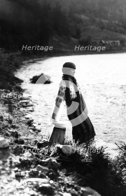 Young woman by a river, Bistrita Valley, Moldavia, north-east Romania, c1920-c1945. Artist: Adolph Chevalier
