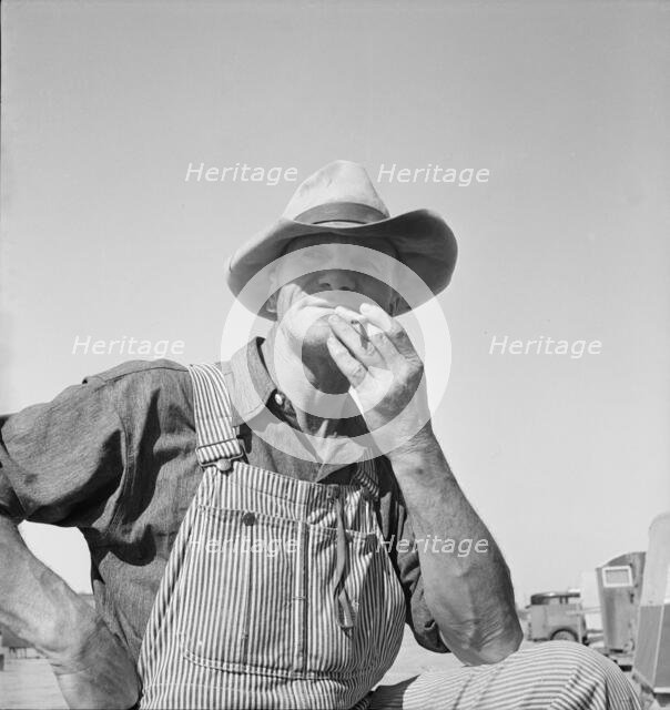 Nebraska farmer come to pick peas, near Calipatria, California, 1939. Creator: Dorothea Lange.