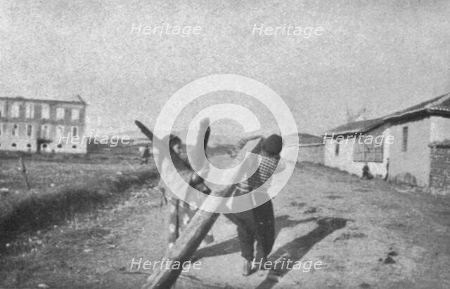''Impressions Macedoniennes; enfants de Guevgueli sauvant des madriers de l'incendie.', 1915. Creator: Unknown.
