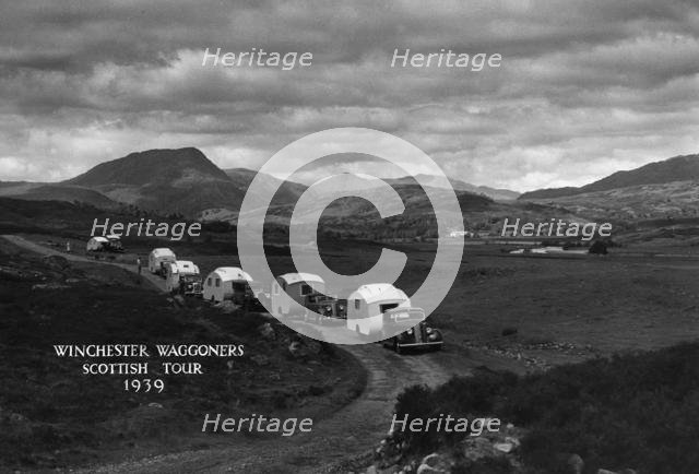 Group of cars and caravans camping in Scottish Highlands 1930's. Creator: Unknown.