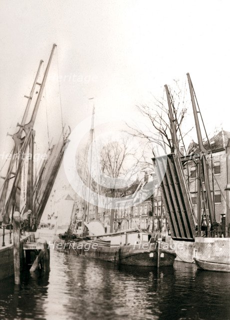 Canal bridge and boats, Dordrecht, Netherlands, 1898.Artist: James Batkin