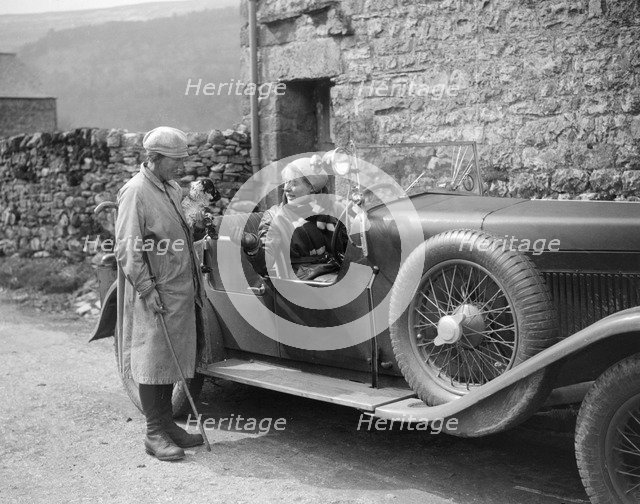 Kitty Brunell in a MG 18/80 open 4-seater, c1930(?). Artist: Bill Brunell.