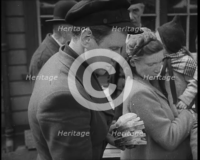 Dutch Refugees Receiving Food at a Reception Centre in the United Kingdom, 1940. Creator: British Pathe Ltd.