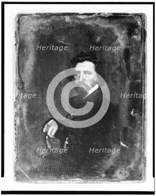 Thomas Hicks, half-length portrait, body in profile to left, facing front, between 1844 and 1860. Creator: Mathew Brady.