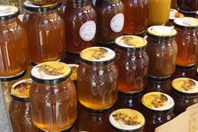 Jars of honey on a market stall, Mallorca, Spain.