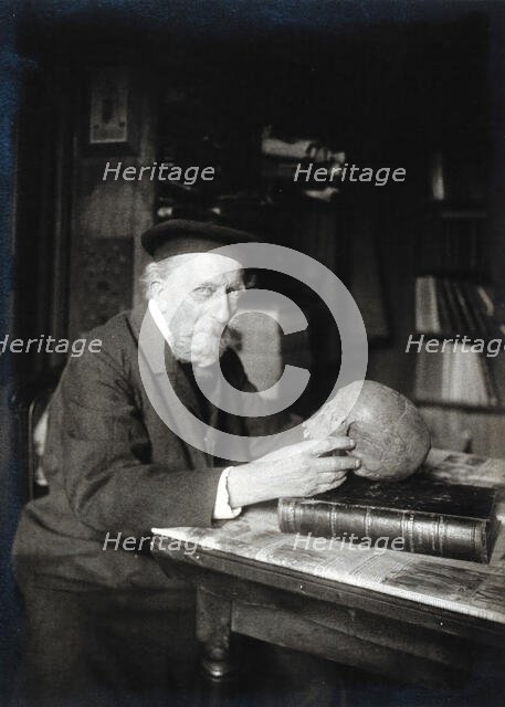 Adrien de Mortillet, holding a skull. Creator: Unknown.