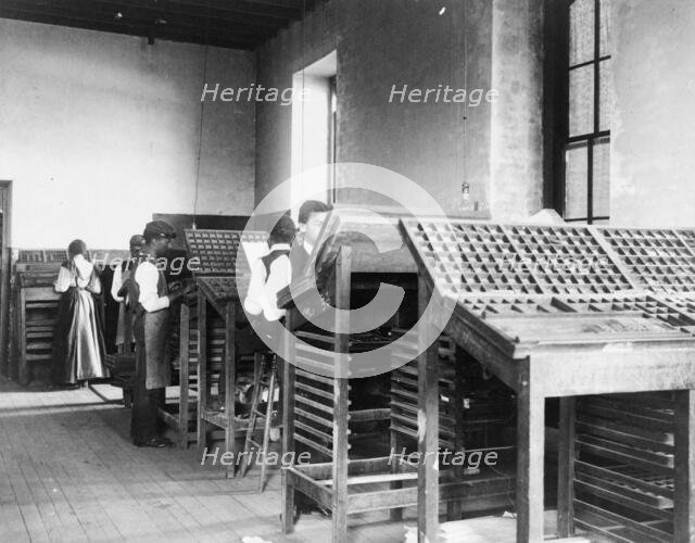 Compositors working in printing shop, Hampton Institute, Hampton, Virginia, 1899 or1900. Creator: Frances Benjamin Johnston.