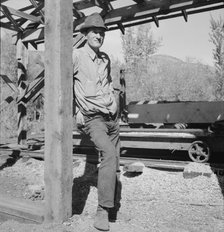 Possibly: Men working in mill, Ola self-help sawmill co-op, Gem County, Idaho, 1939. Creator: Dorothea Lange.
