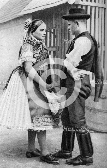A young Slovak couple, Hungary, 1926.Artist: AW Cutler