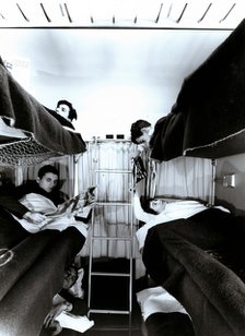 Interior of a traveler car wagon with bunks, 1950.