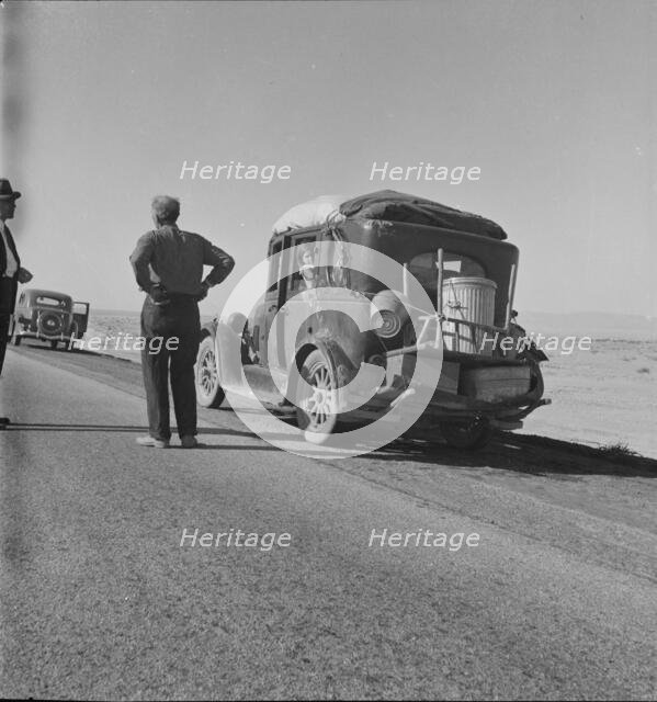 Migrant from Chickasaw, Oklahoma, stalled on the desert in southern California with no money, 1937. Creator: Dorothea Lange.