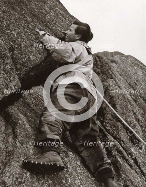Boy climbing rock face, Outward Bound School, Eskdale, Cumbria,1950. Artist: Unknown
