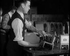 Male Civilians Building Radio Wireless Sets in a Factory, 1931. Creator: British Pathe Ltd.