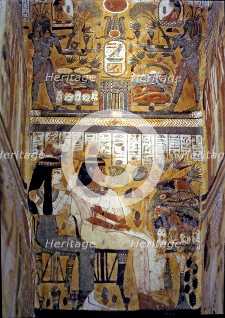 Frescoes inside a sarcophagus in wood.