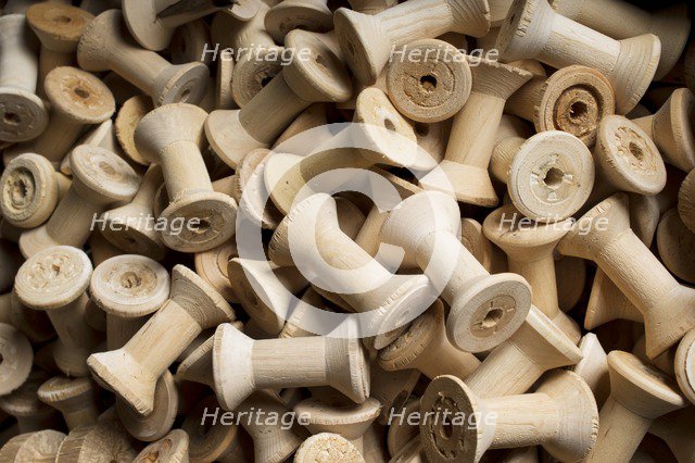Bobbins for cotton reels awaiting waxing, Stott Park Bobbin Mill, Cumbria, c2014. Artist: Alun Bull.