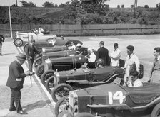 Cars on the start line for a motor race at Brooklands. Artist: Bill Brunell.